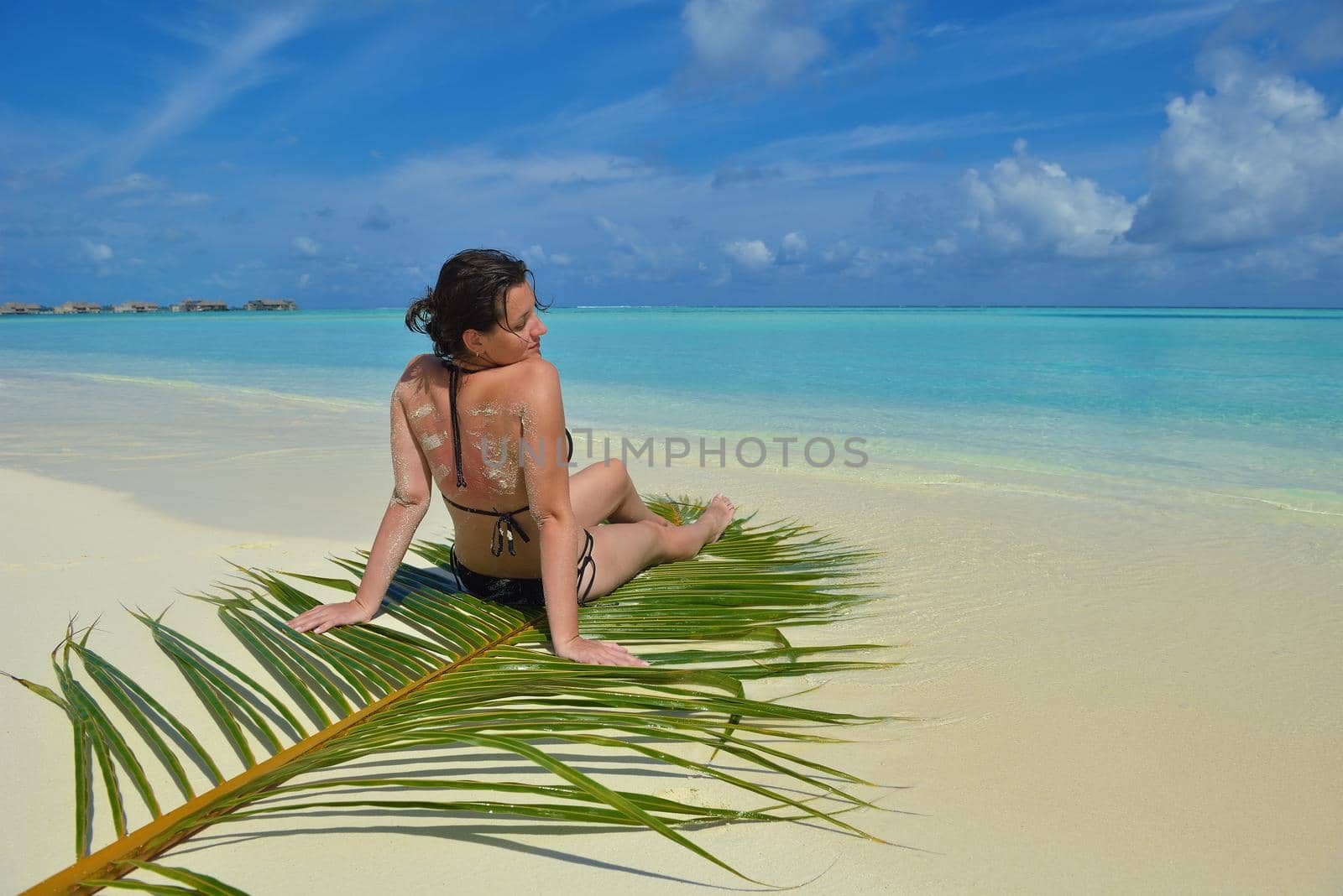 happy young woman on summer vacation on beautiful tropical beach have fun enjoy and relax