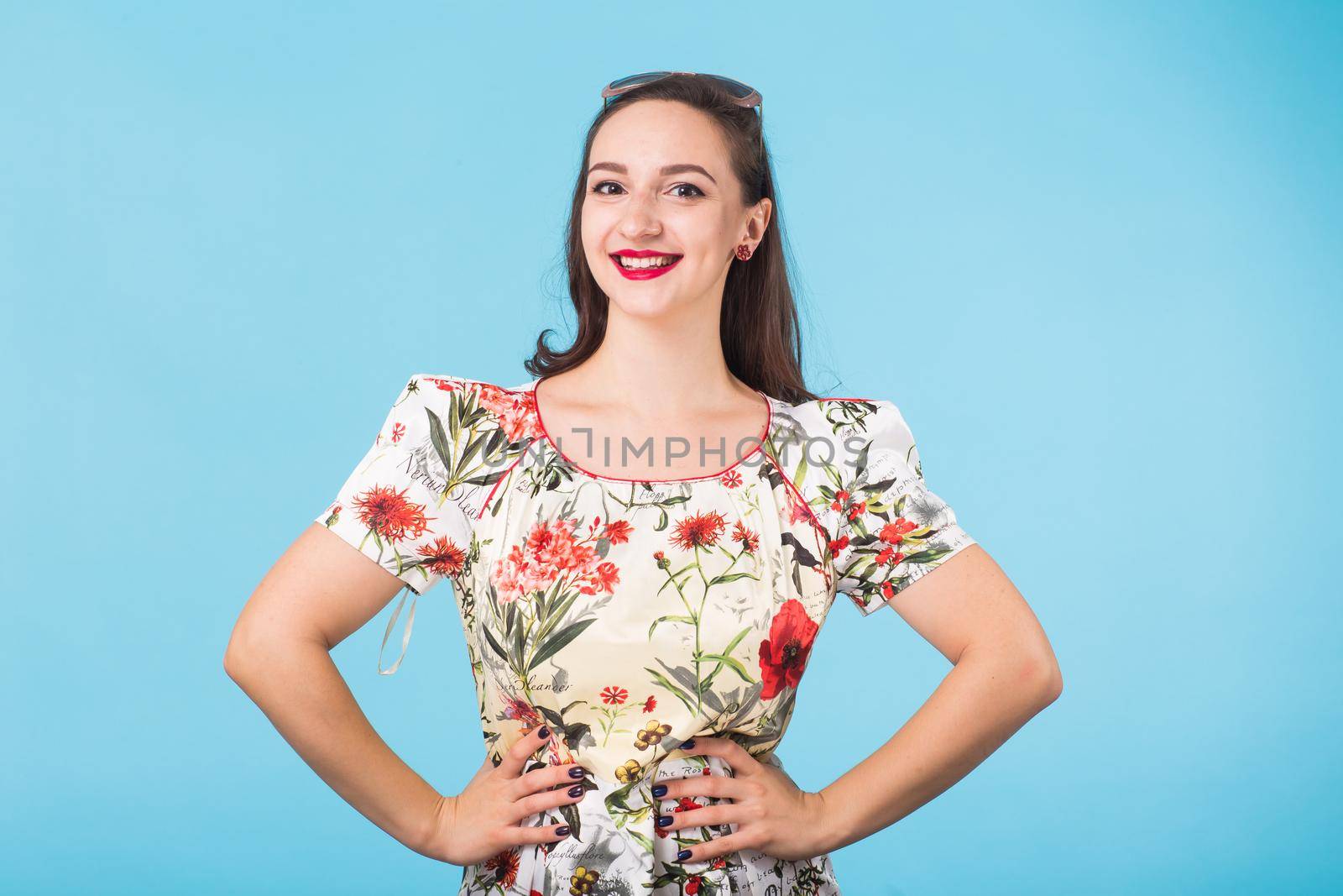 Portrait of young beautiful woman cheerfuly smiling looking at camera. Isolated on pastel blue background. Copy space. by Satura86