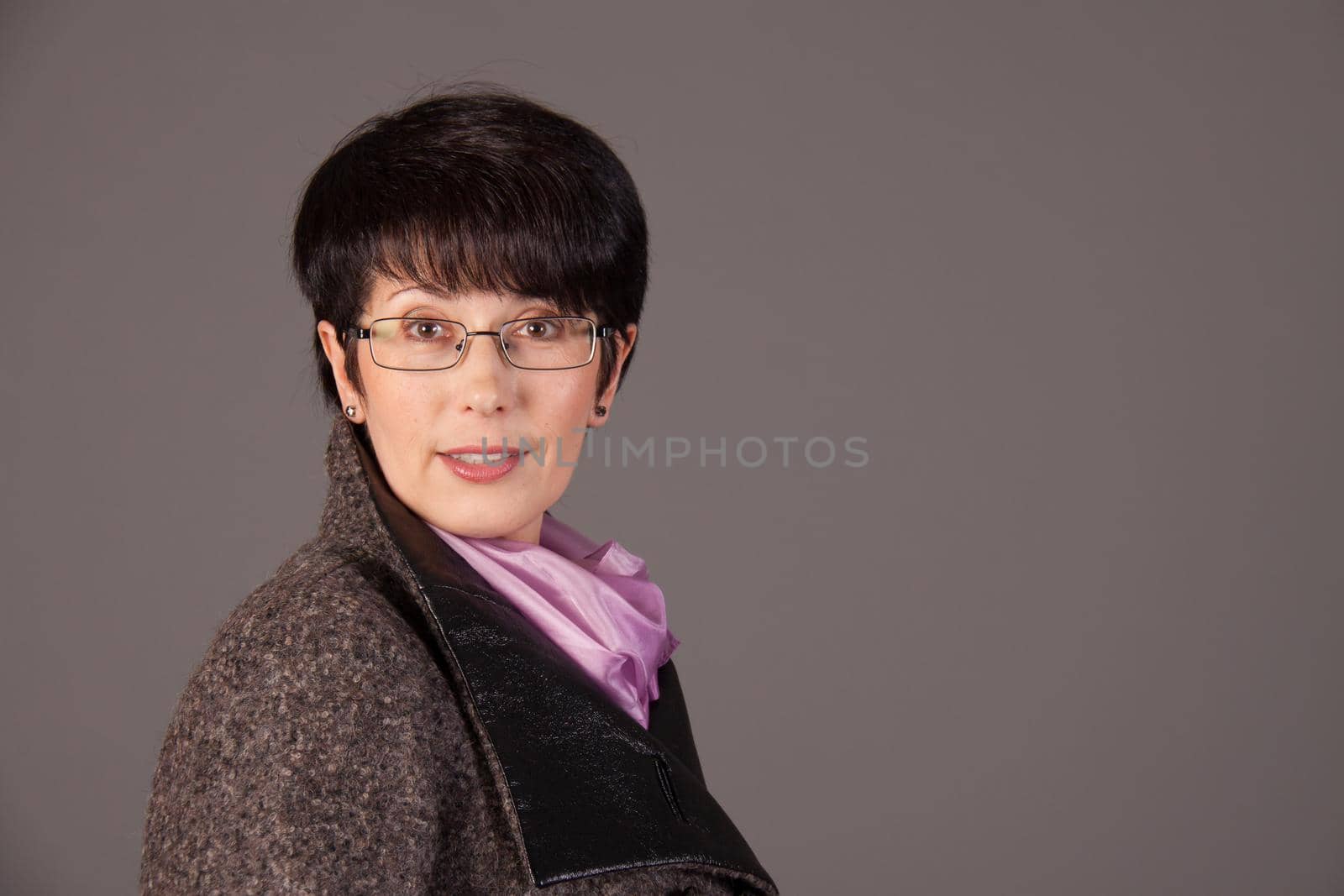 Elegant middle aged woman posing in studio by Satura86