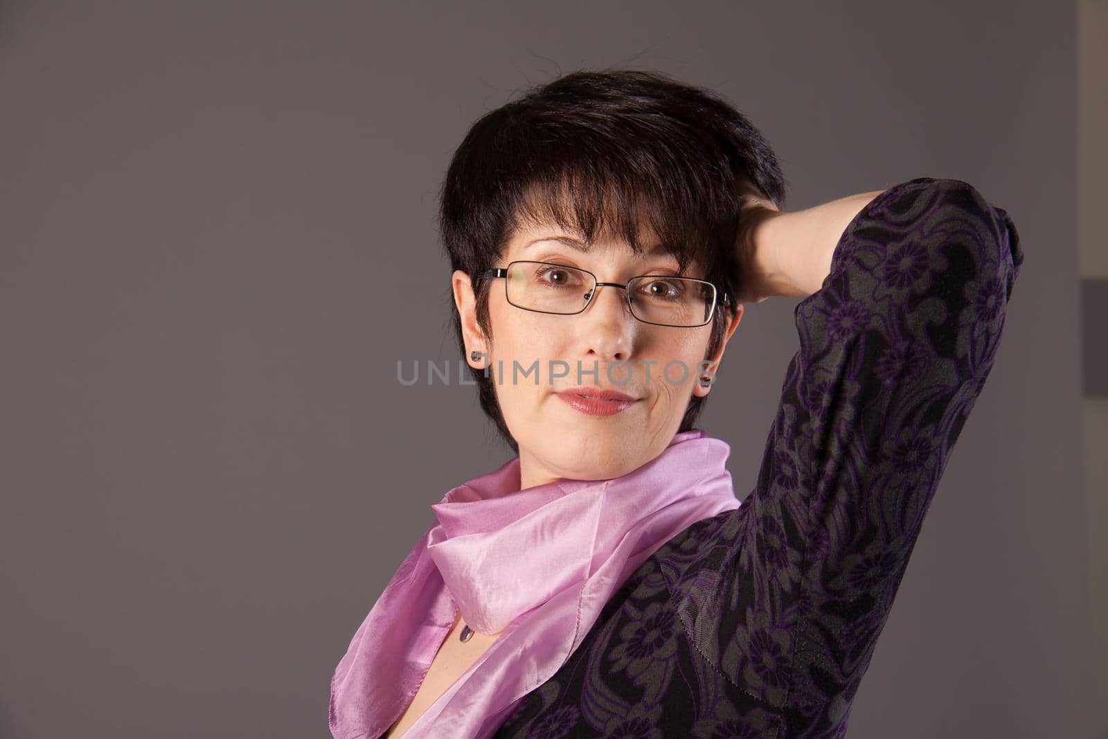 Elegant middle aged woman posing in studio by Satura86