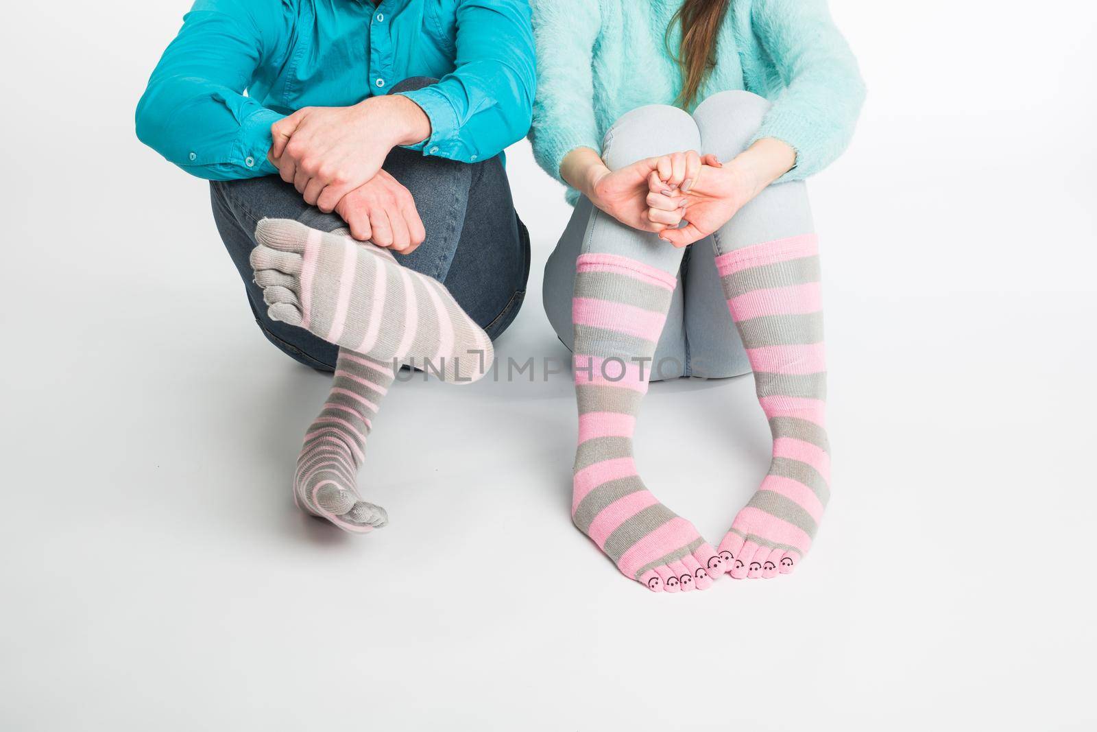 Valentine's day concept - Male and female legs in socks