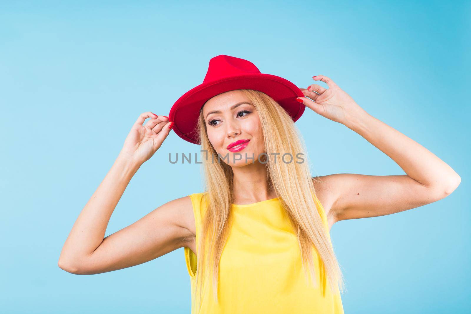 Young woman fashion lookbook model studio portrait on blue background. by Satura86