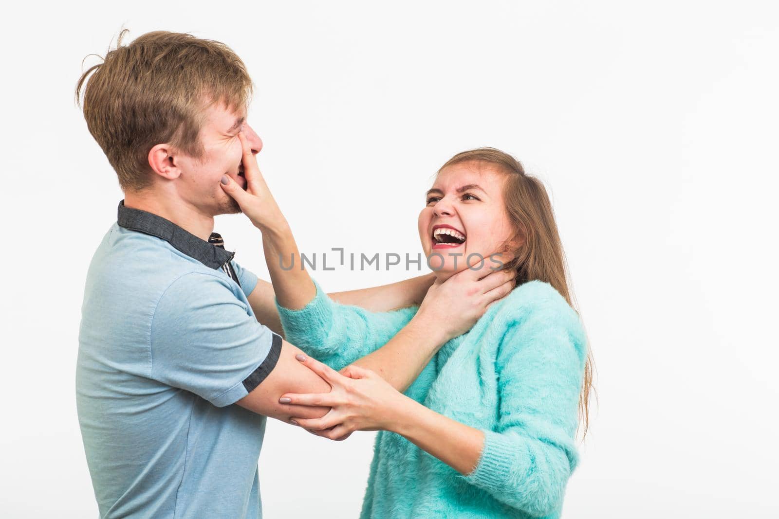 domestic violence, abuse and people concept - man beating woman on white background by Satura86