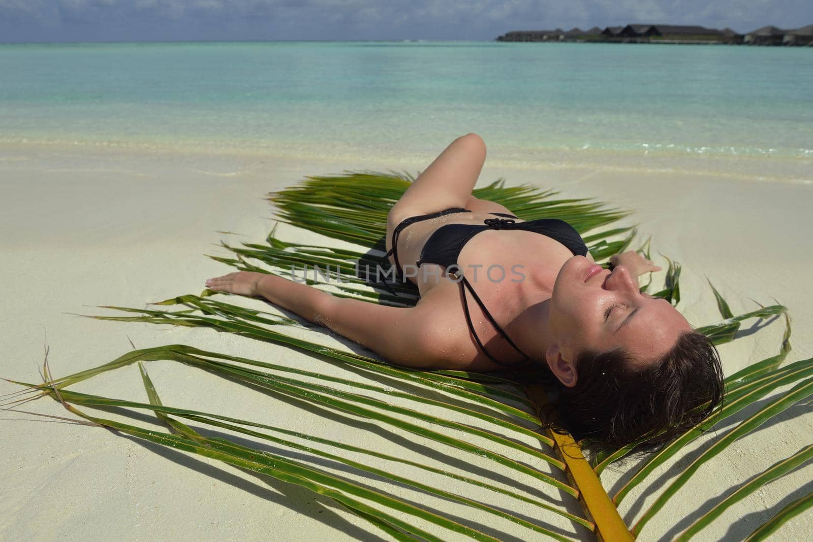 happy young woman on summer vacation on beautiful tropical beach have fun enjoy and relax