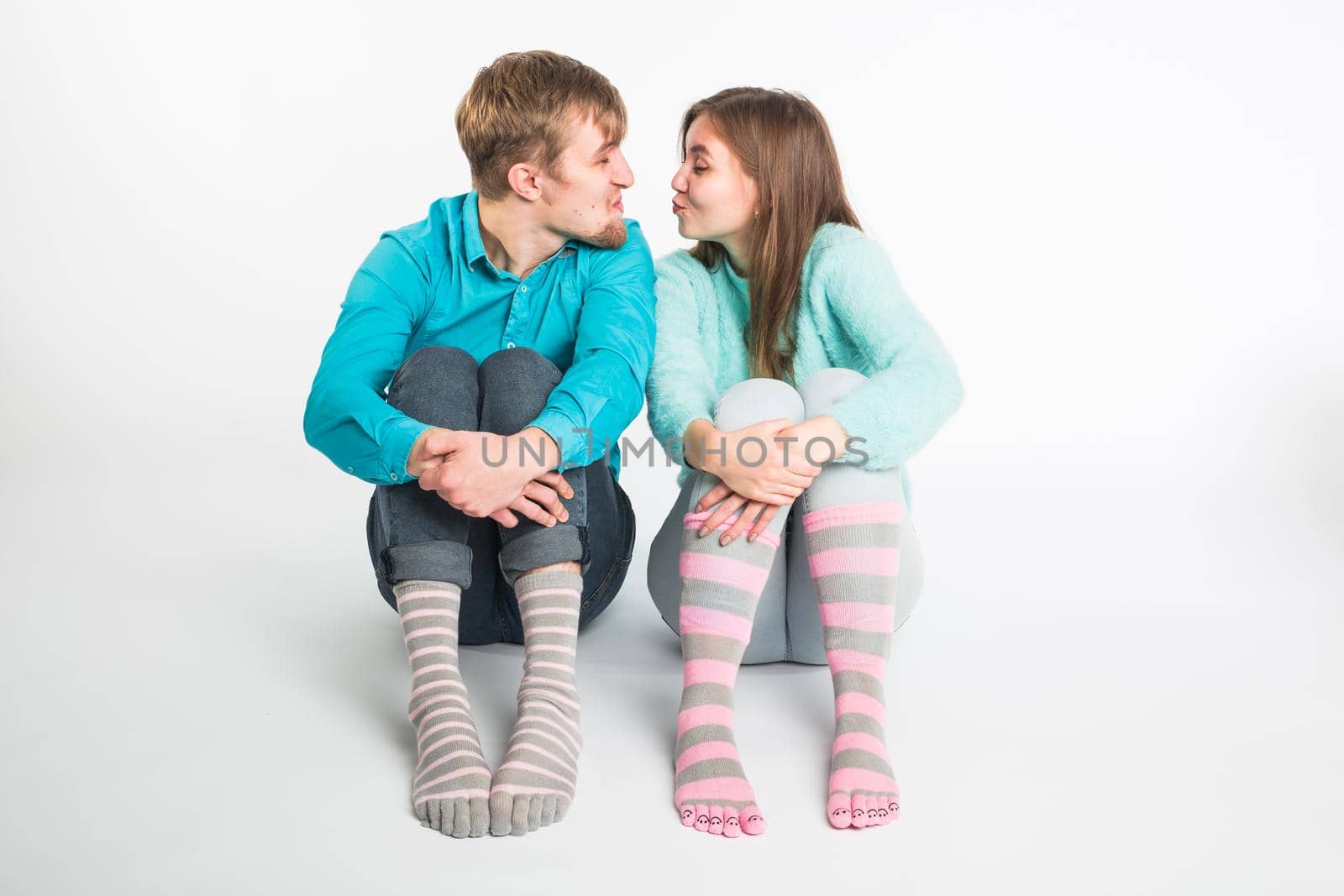 Happy couple having fun and fooling around. Joyful man and woman have nice time. Good relationship and valentines day concept.