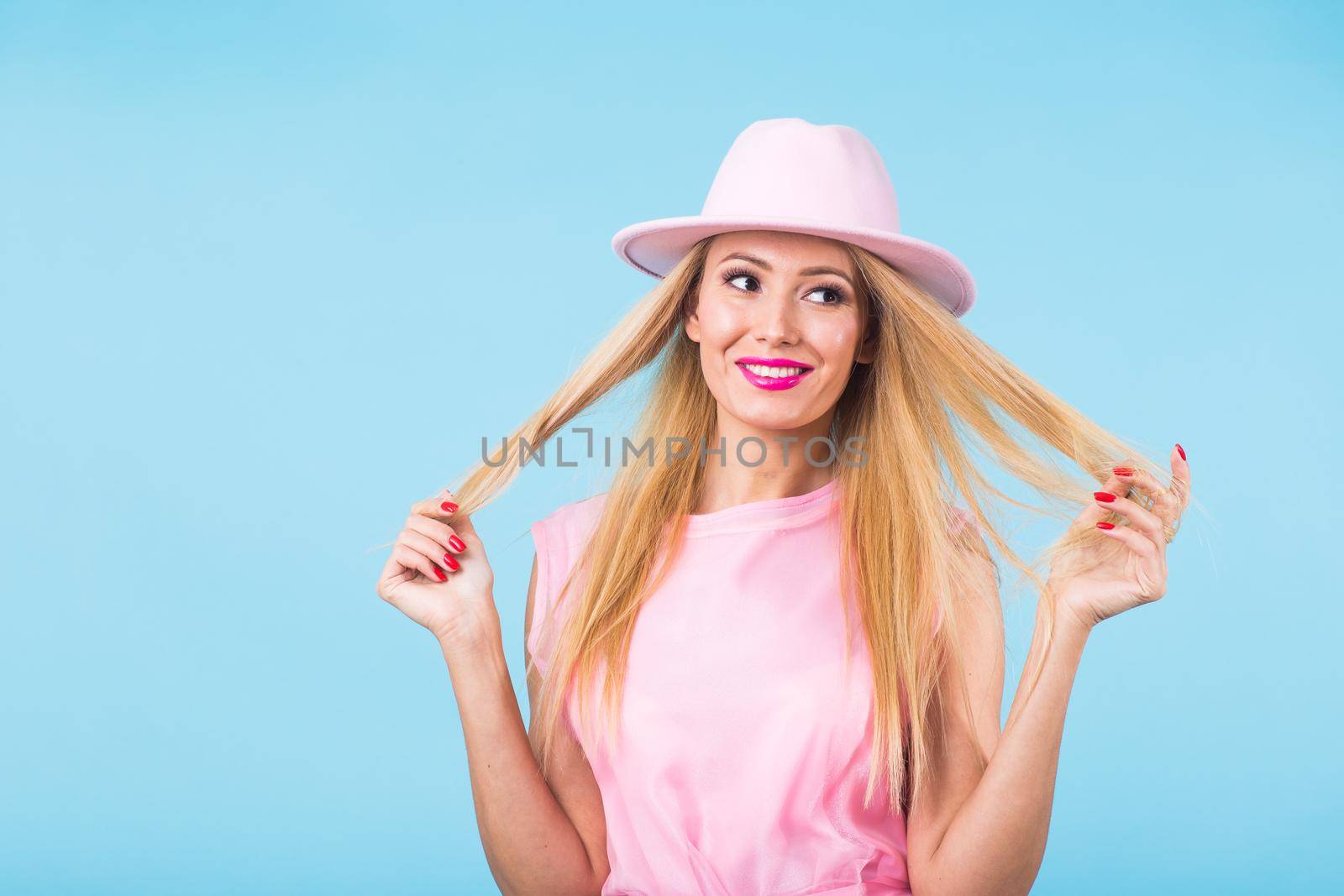 Young woman fashion lookbook model studio portrait on blue background. by Satura86