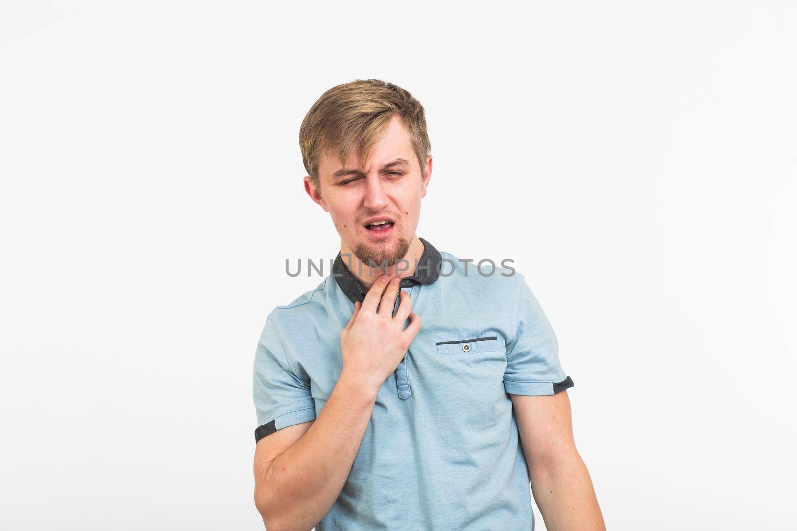 Sore throat. Men touching the neck on white background by Satura86