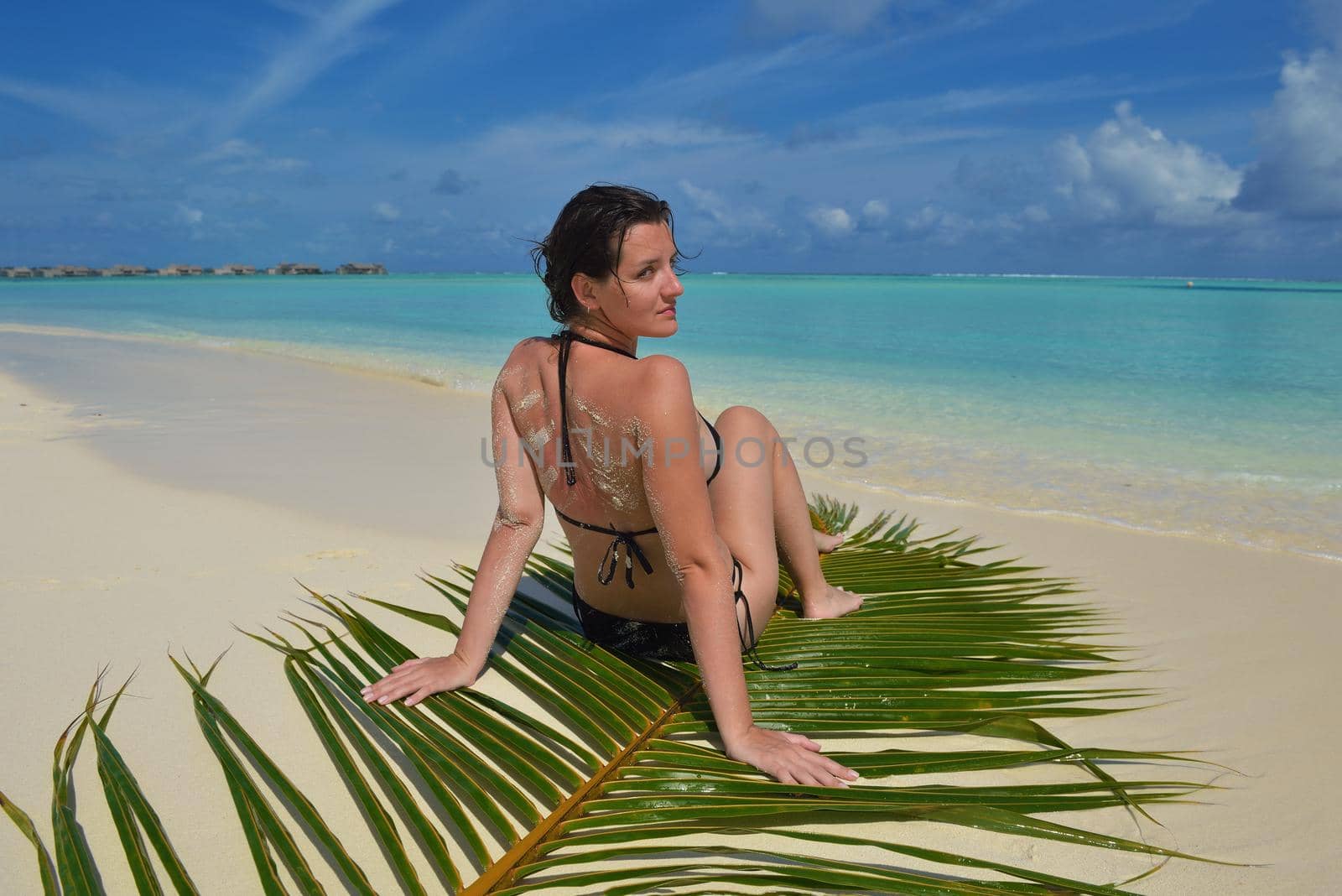 happy young woman on summer vacation on beautiful tropical beach have fun enjoy and relax