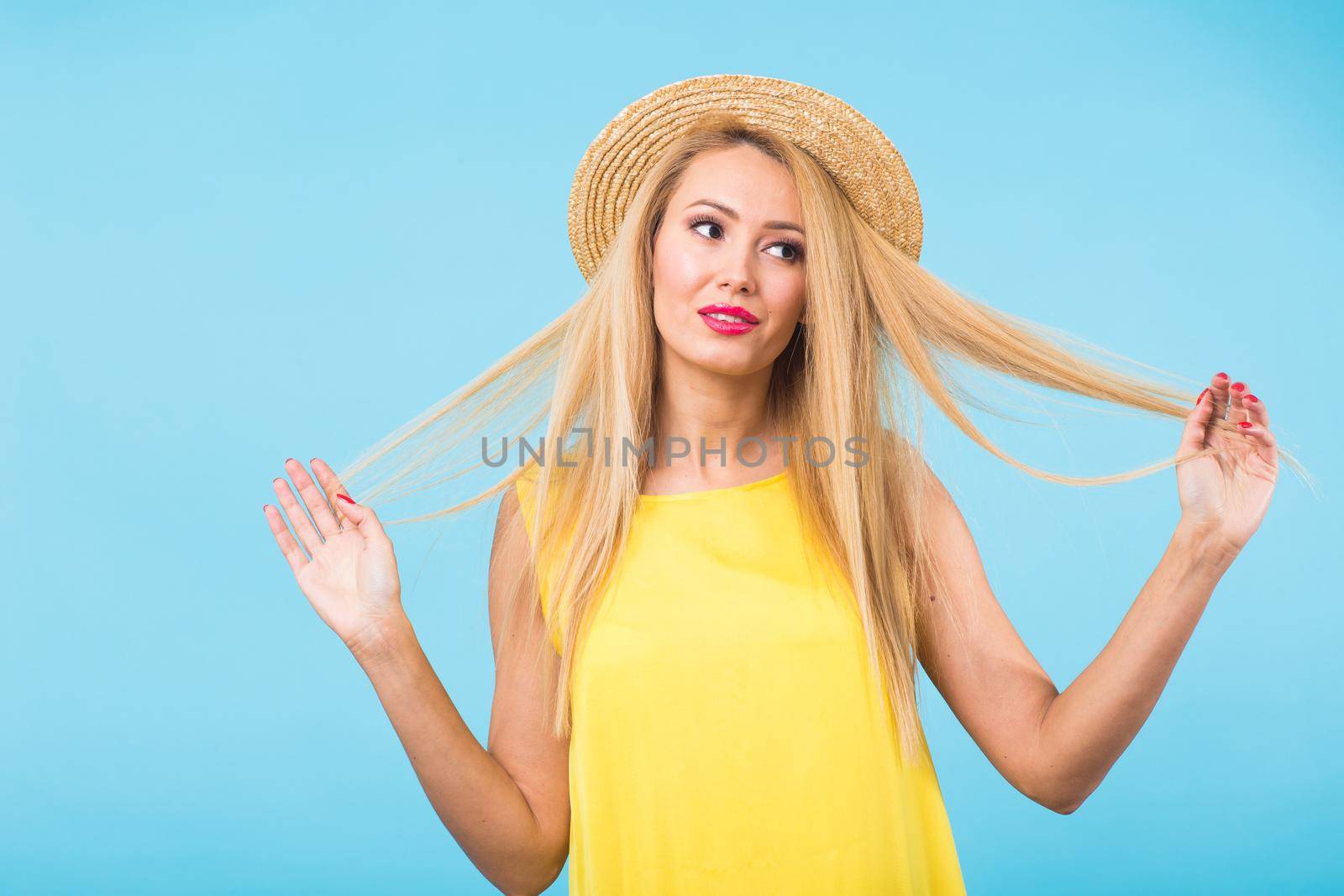 Young woman fashion lookbook model studio portrait on blue background. by Satura86