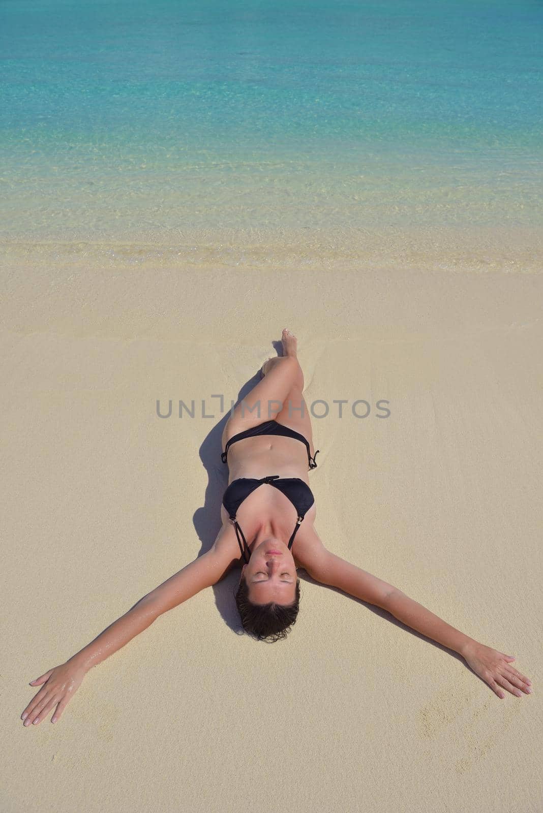 happy young woman on summer vacation on beautiful tropical beach have fun enjoy and relax