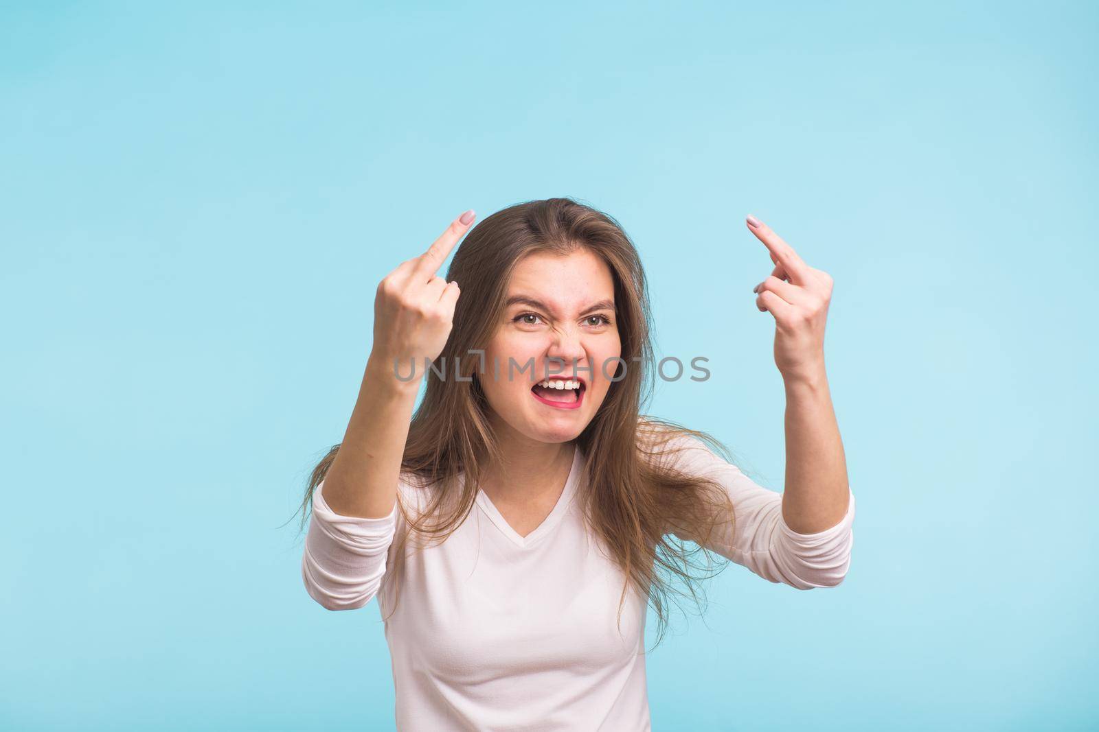 Angry aggressive woman with ferocious expression on blue background by Satura86