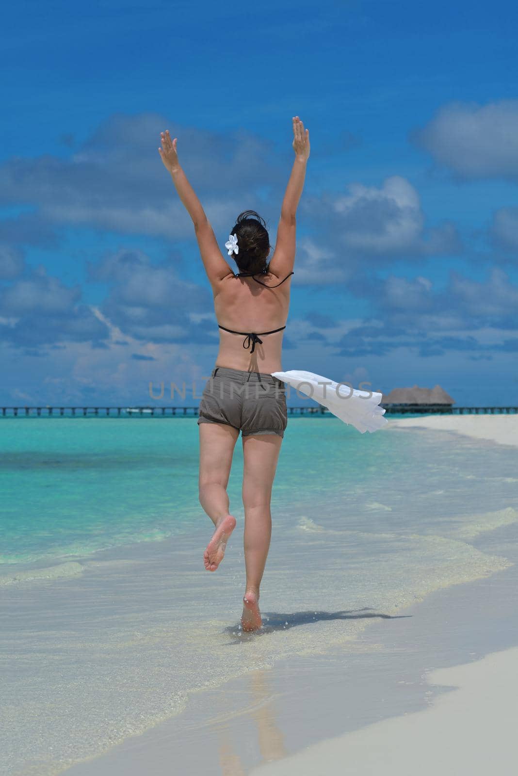 happy young woman on summer vacation on beautiful tropical beach have fun enjoy and relax