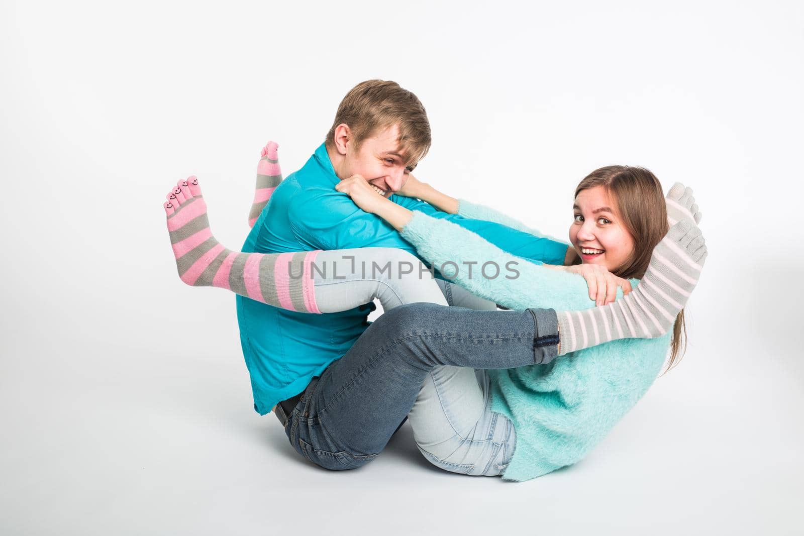 Happy couple having fun and fooling around. Joyful man and woman have nice time. Good relationship and valentines day concept.