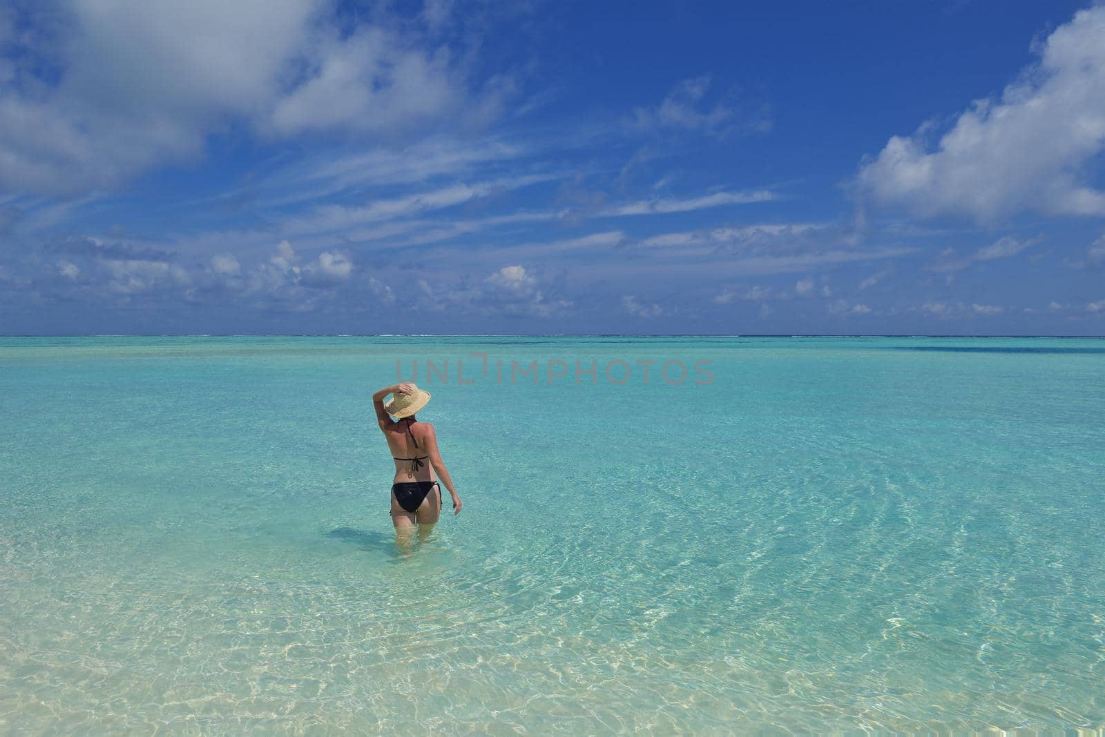 happy young woman on summer vacation on beautiful tropical beach have fun enjoy and relax