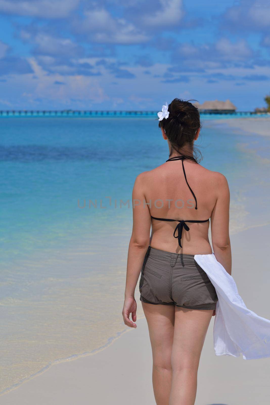 happy young woman on summer vacation on beautiful tropical beach have fun enjoy and relax