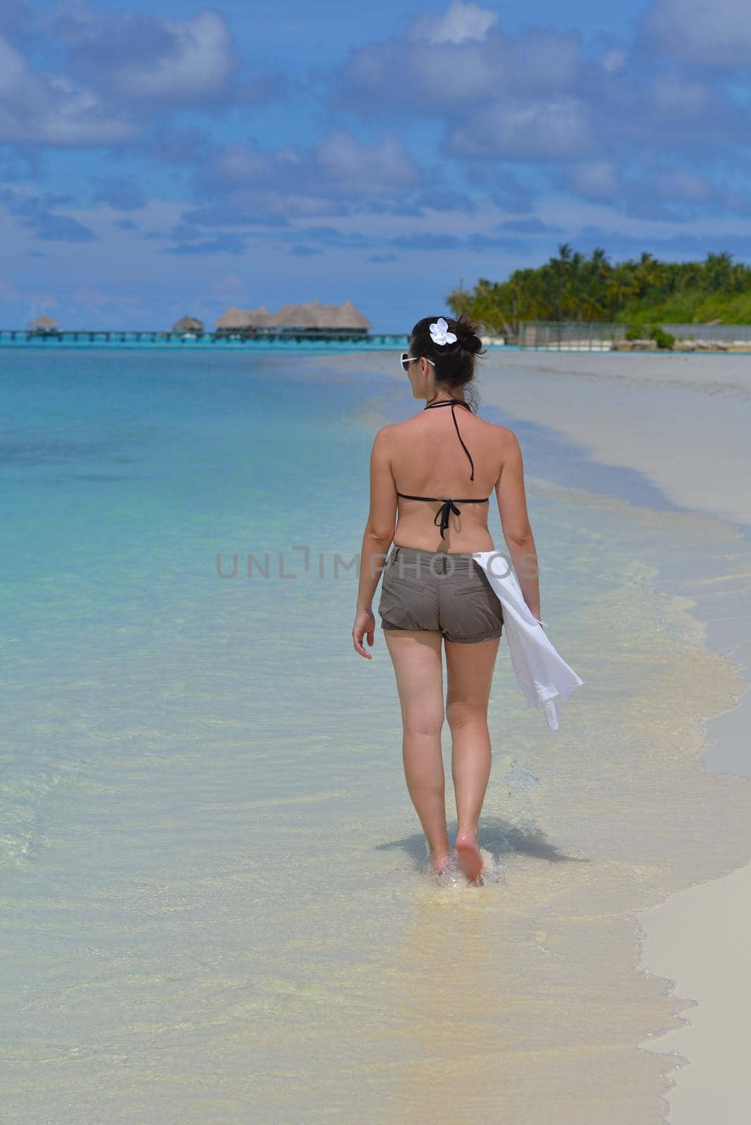 happy young woman on summer vacation on beautiful tropical beach have fun enjoy and relax