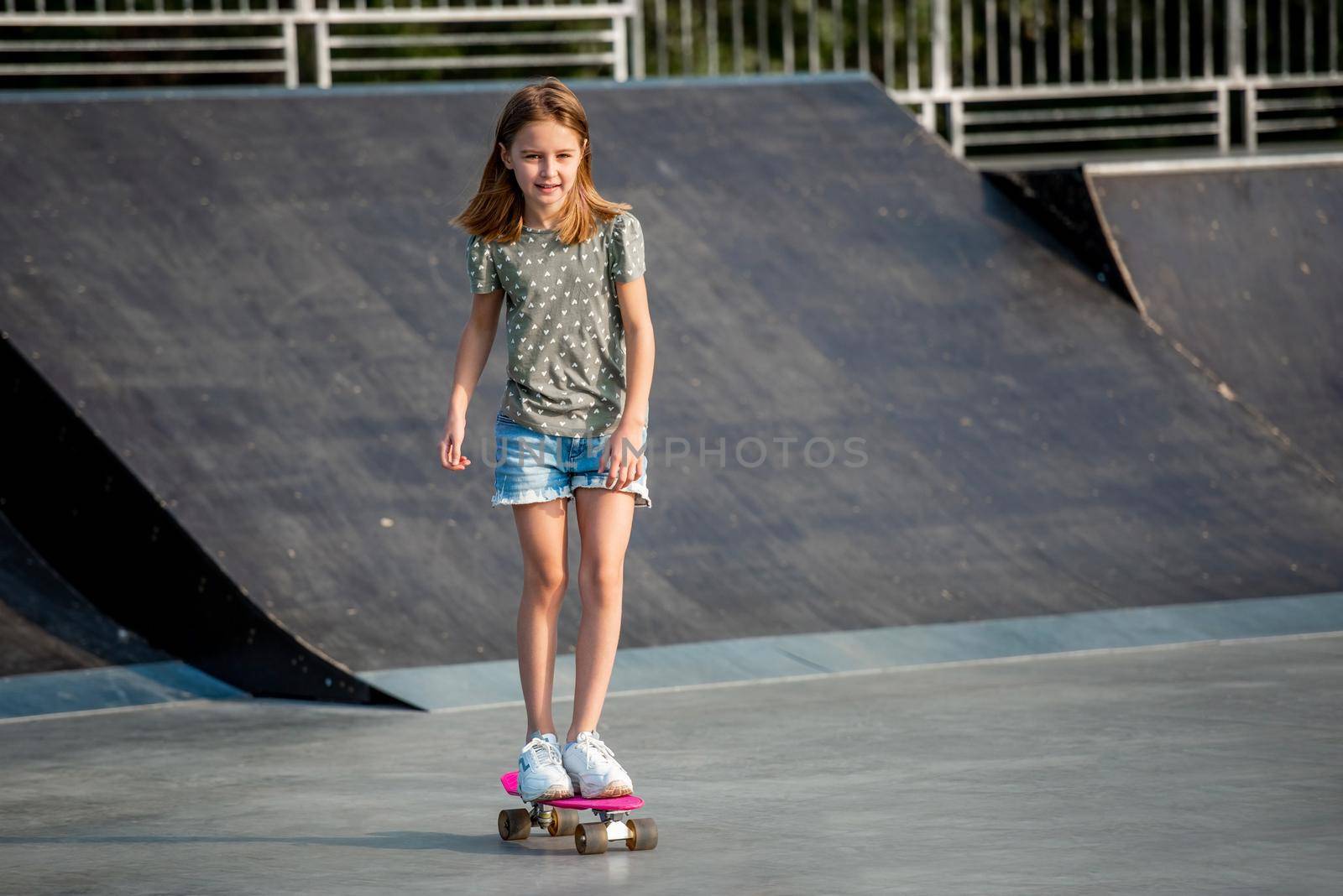 Girl with skateboard outdoors by tan4ikk1