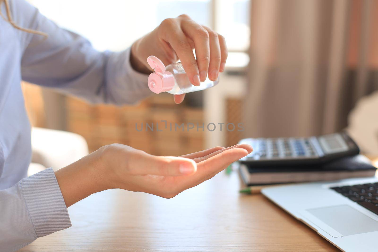 Woman using sanitizer hand gel. Hand hygiene coronavirus protection. by tsyhun