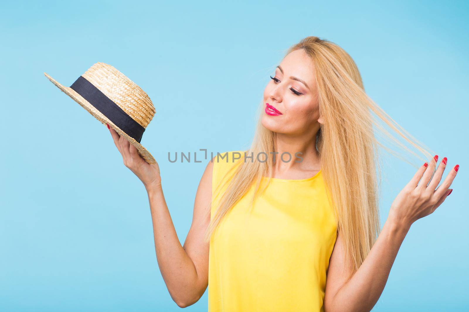 Young woman fashion lookbook model studio portrait on blue background. by Satura86