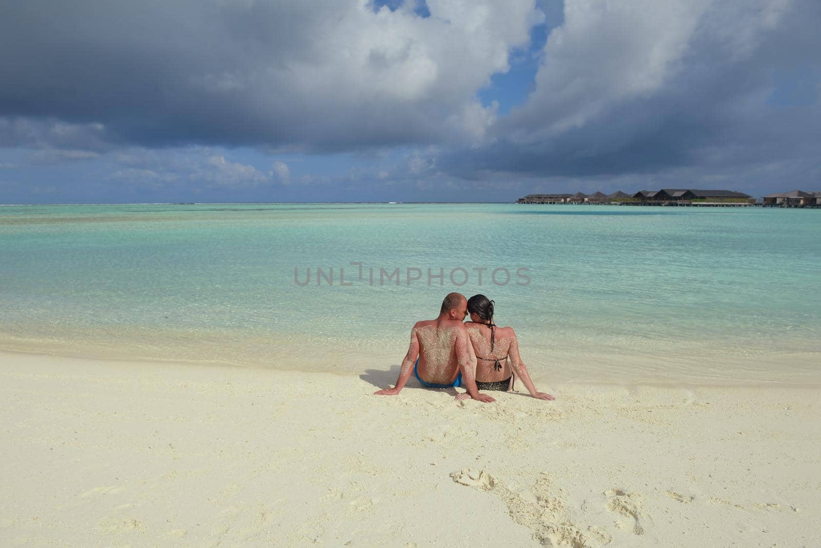 happy young romantic couple in love have fun running and relaxing on beautiful beach