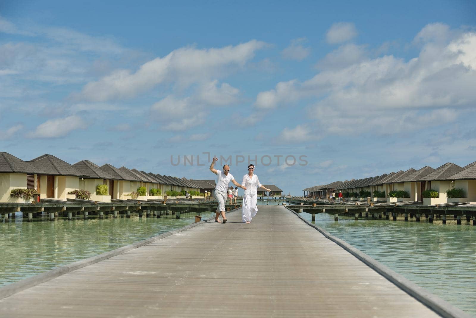 happy young romantic couple in love have fun running and relaxing on beautiful beach