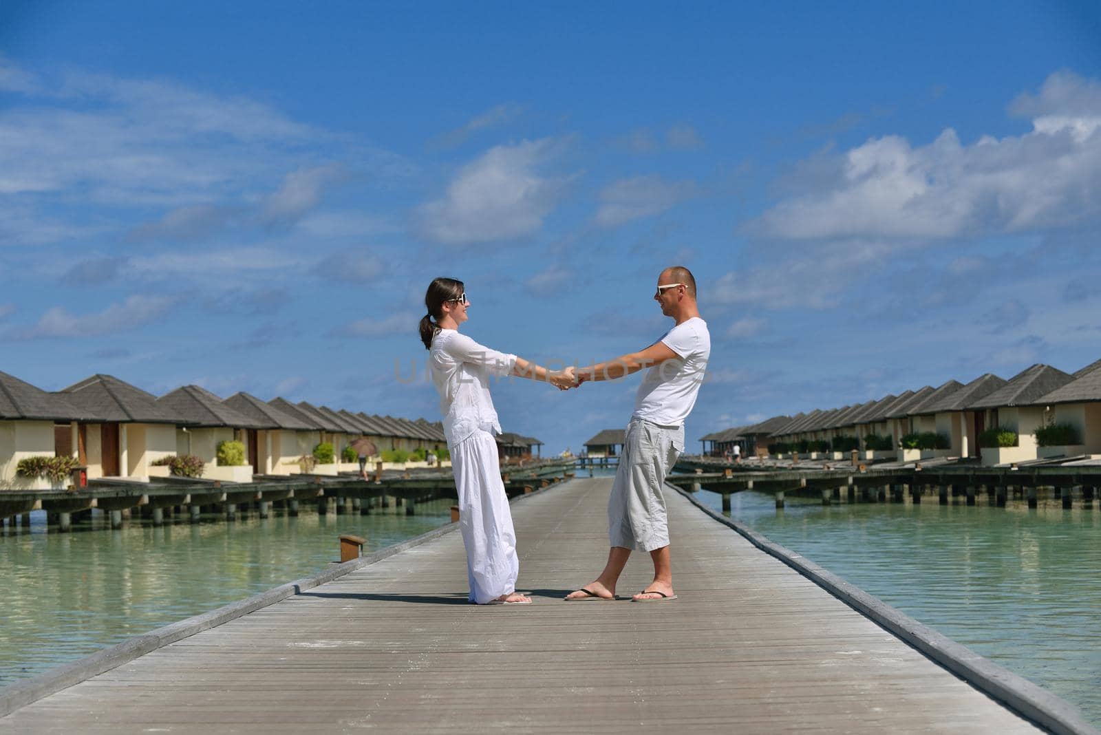 happy young romantic couple in love have fun running and relaxing on beautiful beach