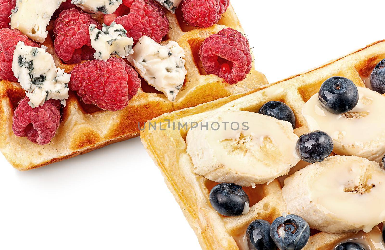 French waffles with berries, bananas and dorblu cheese isolated on white by Cipariss