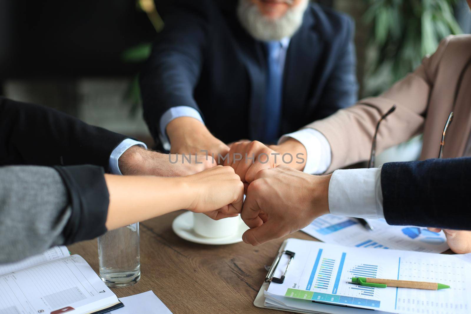 Business people teamwork stacking hand together concept