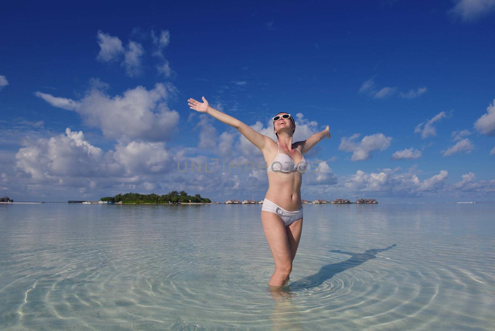 happy young woman on summer vacation on beautiful tropical beach have fun enjoy and relax