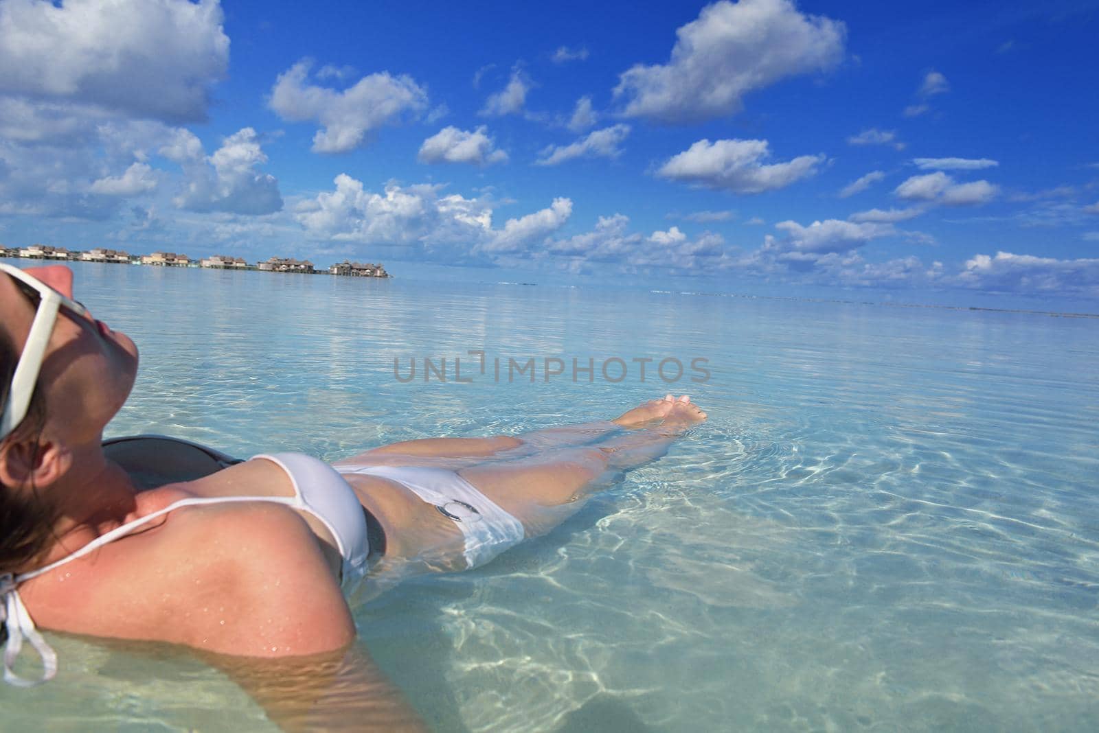 happy young woman on summer vacation on beautiful tropical beach have fun enjoy and relax