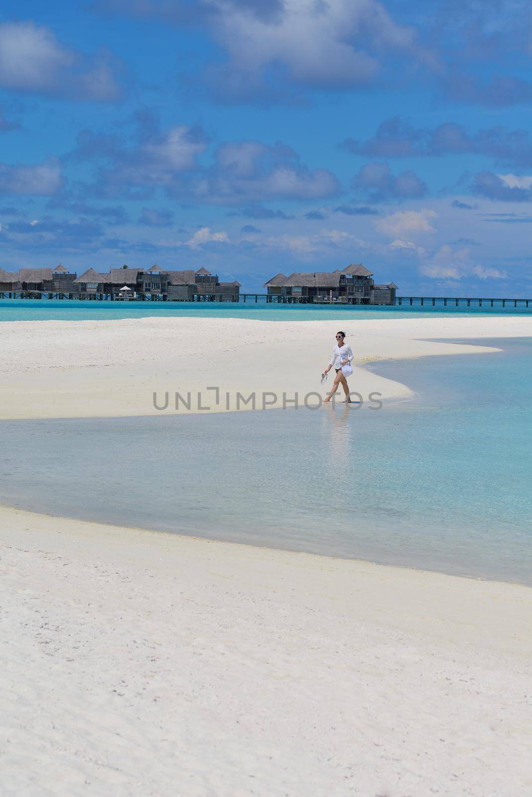 happy young woman on summer vacation on beautiful tropical beach have fun and relax