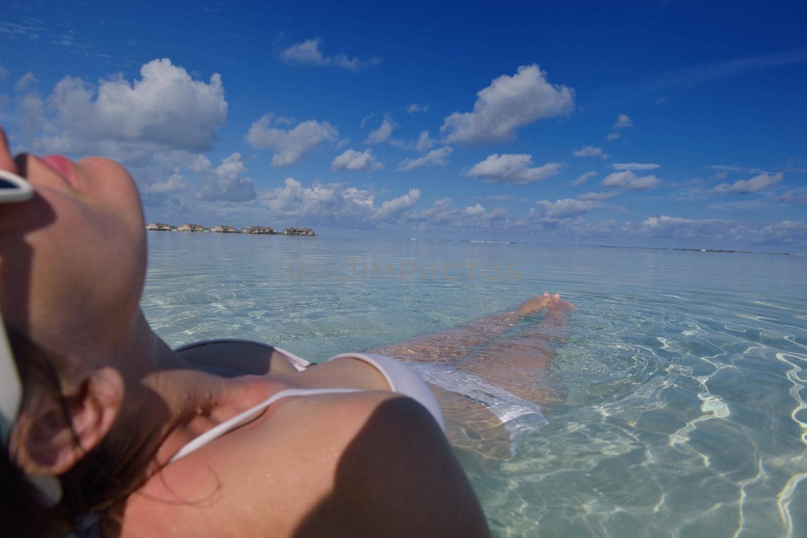 happy young woman on summer vacation on beautiful tropical beach have fun enjoy and relax