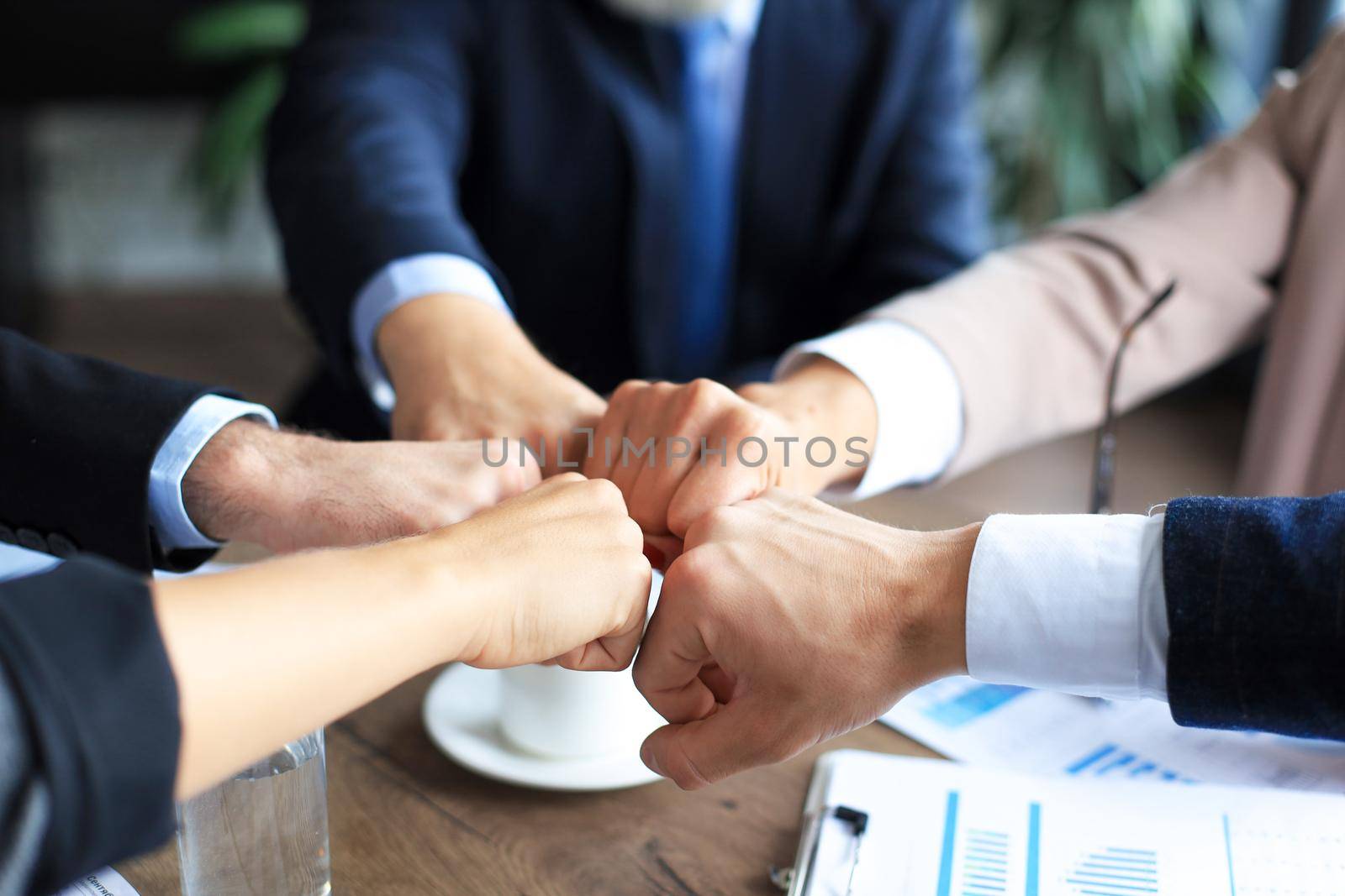 Business people teamwork stacking hand together concept. by tsyhun