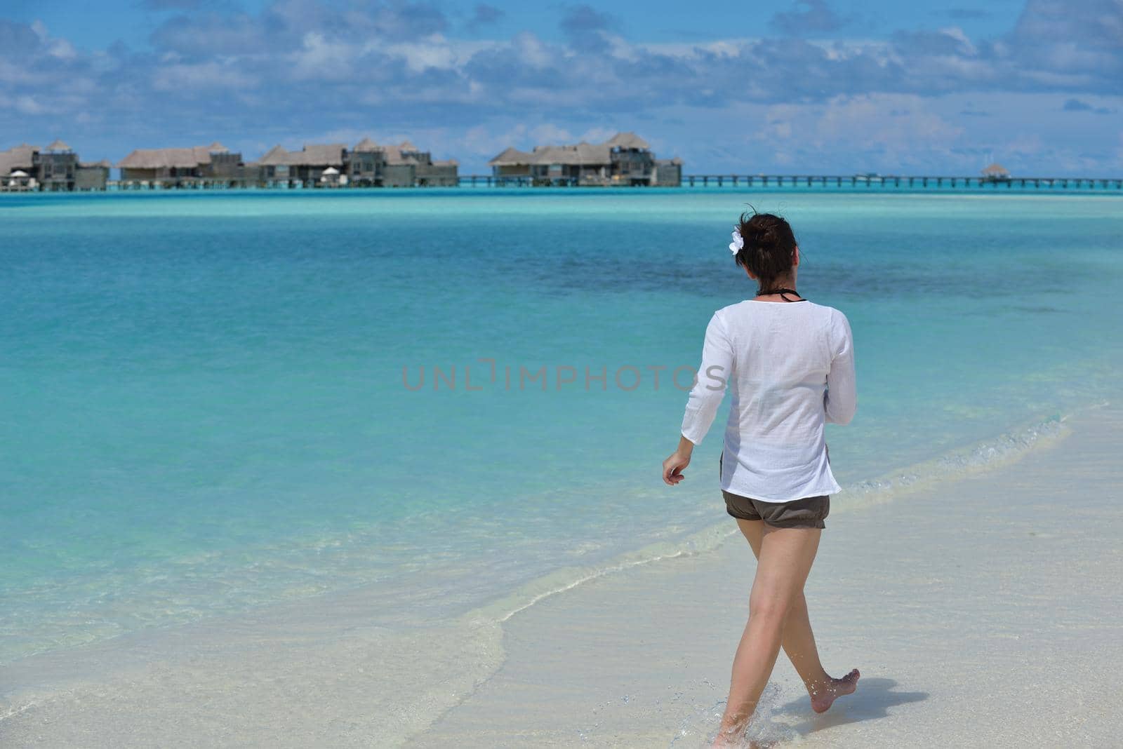 happy young woman on summer vacation on beautiful tropical beach have fun enjoy and relax