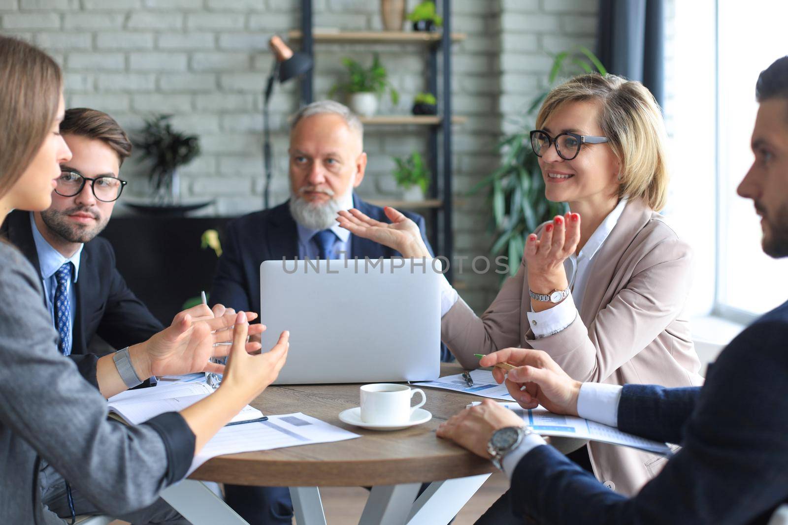 Portrait of a positive business employees at an office business meeting