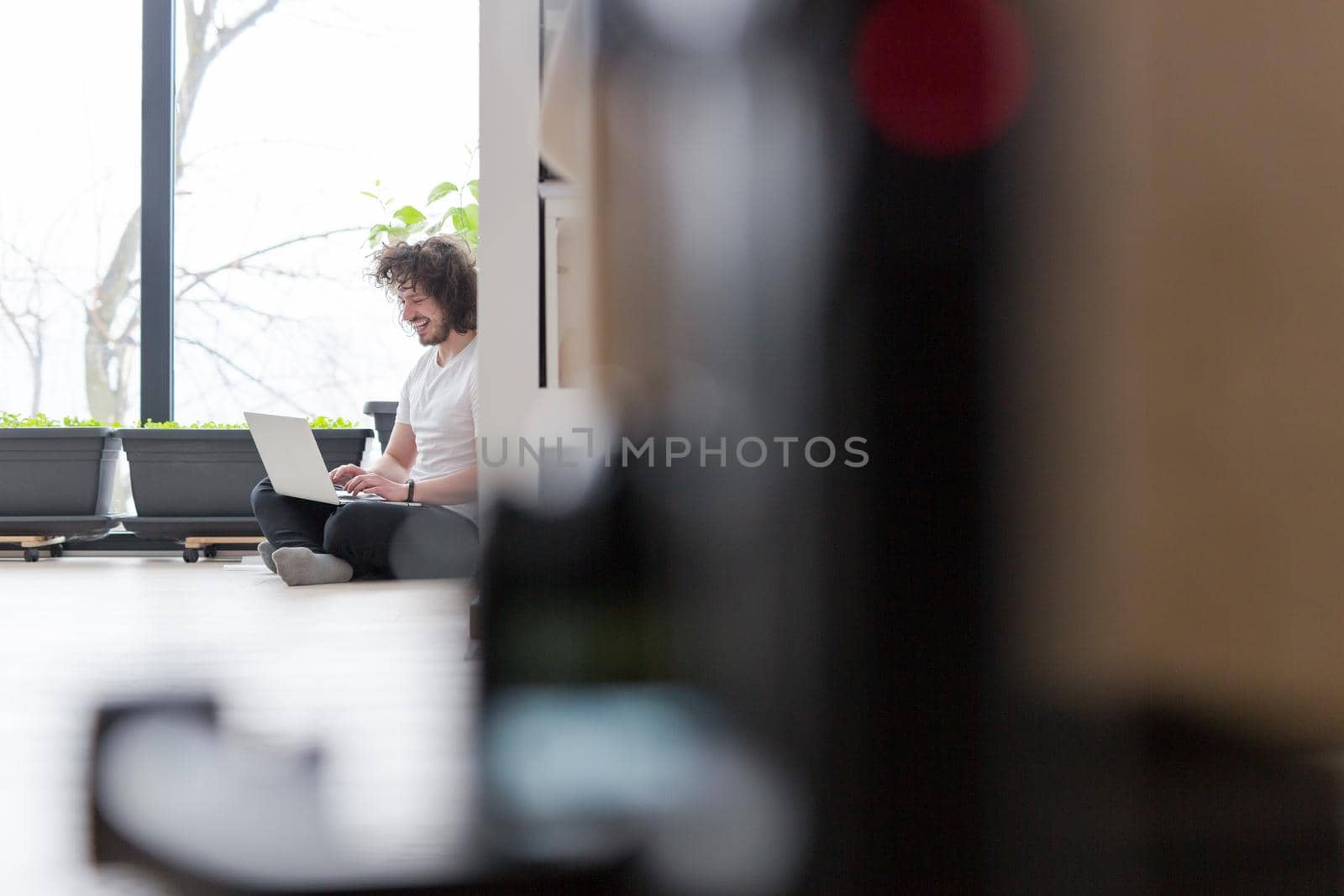 Real man Using laptop on the floor At Home  Enjoying Relaxing