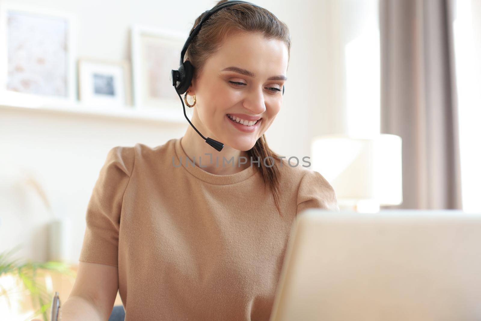 Female customer support operator with headset and smiling
