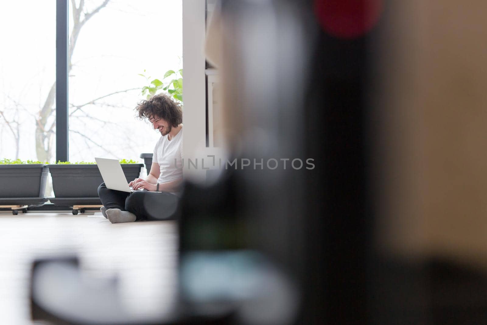 Real man Using laptop on the floor At Home  Enjoying Relaxing