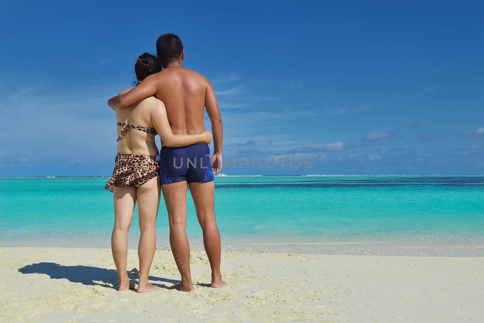 happy young asian couple have fun and romantic time at  summer on beautiful white sand beach