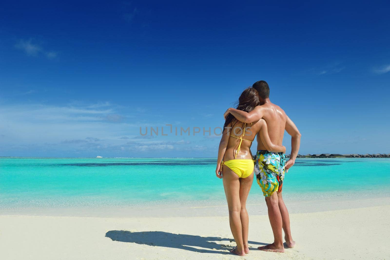 happy young asian couple have fun and romantic time at  summer on beautiful white sand beach