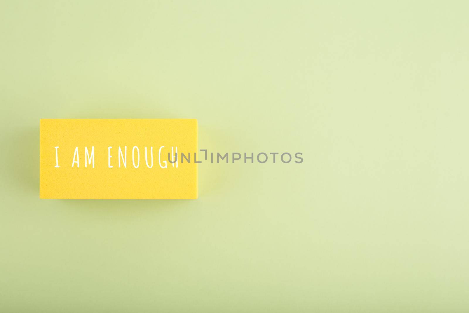 I am enough trendy minimal concept on bright green background. Lettering design, motivation quote, self acceptance and mental health