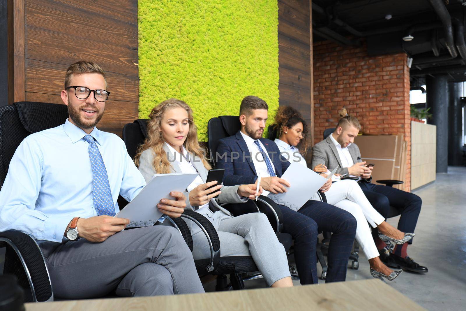 Modern business people waiting for job interview.