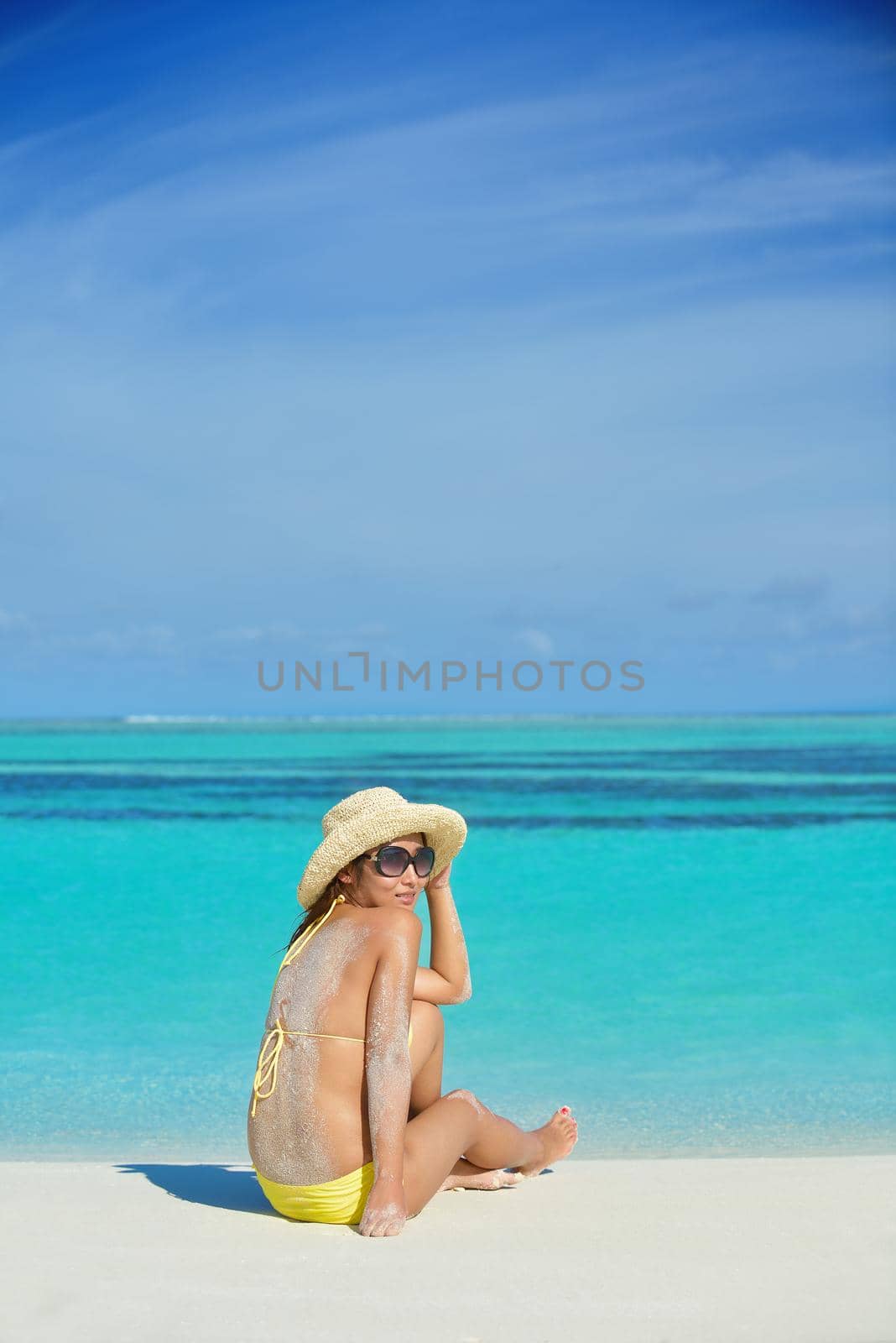 beautiful  woman relax on tropical  beach by dotshock