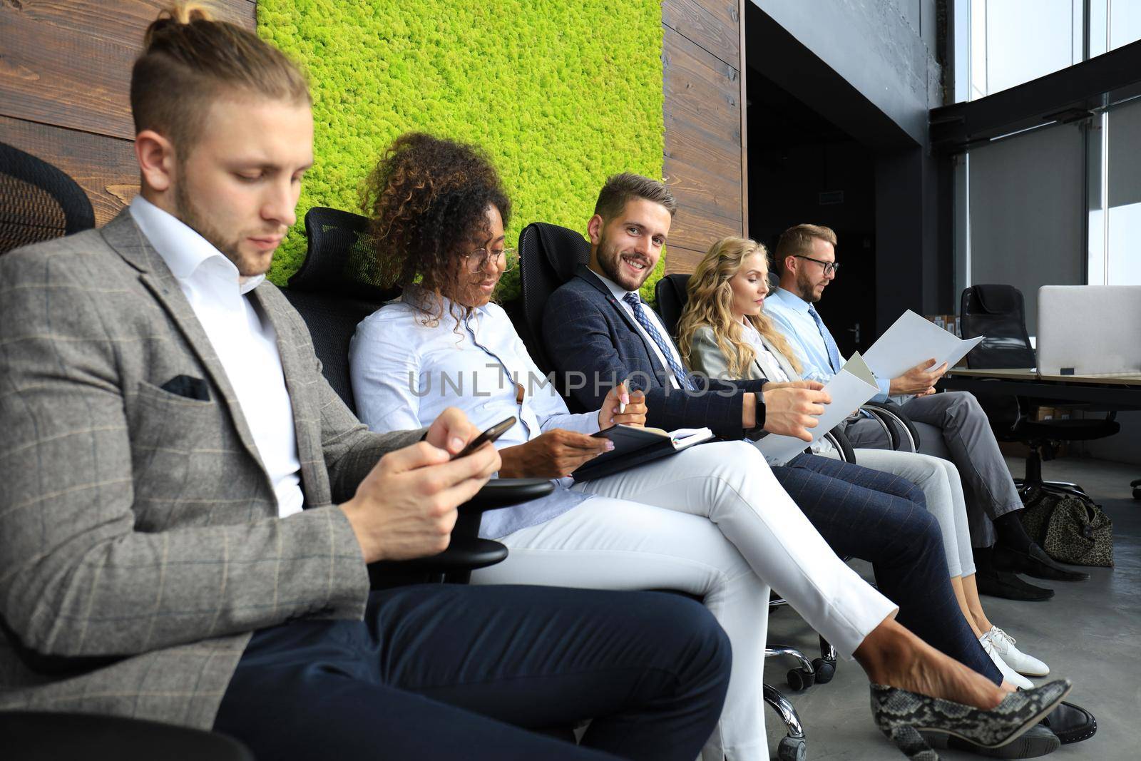 Modern business people waiting for job interview.