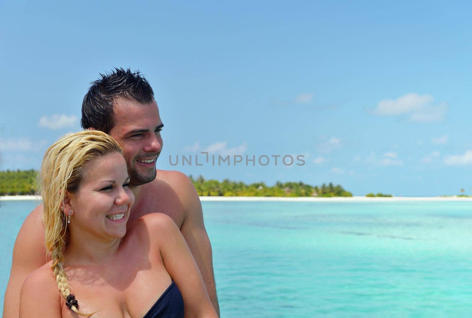 happy young  couple at summer vacation have fun and relax by dotshock