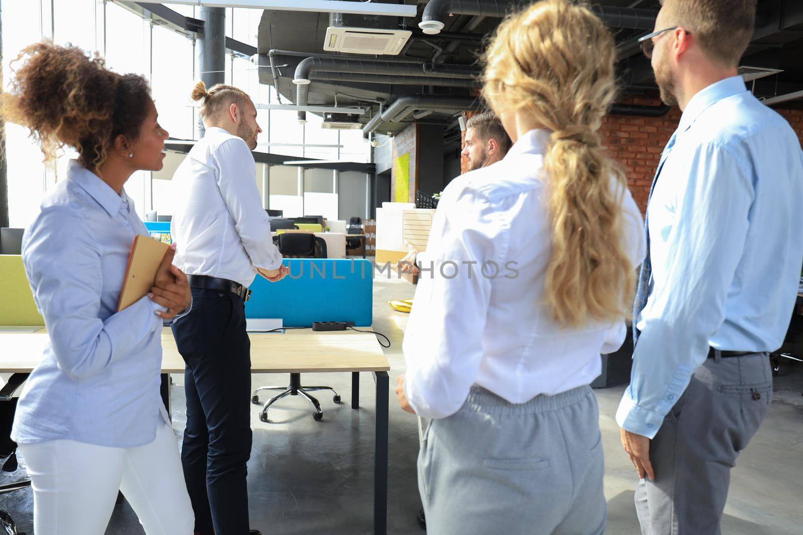 Business colleagues say goodbye to the dismissed employee.