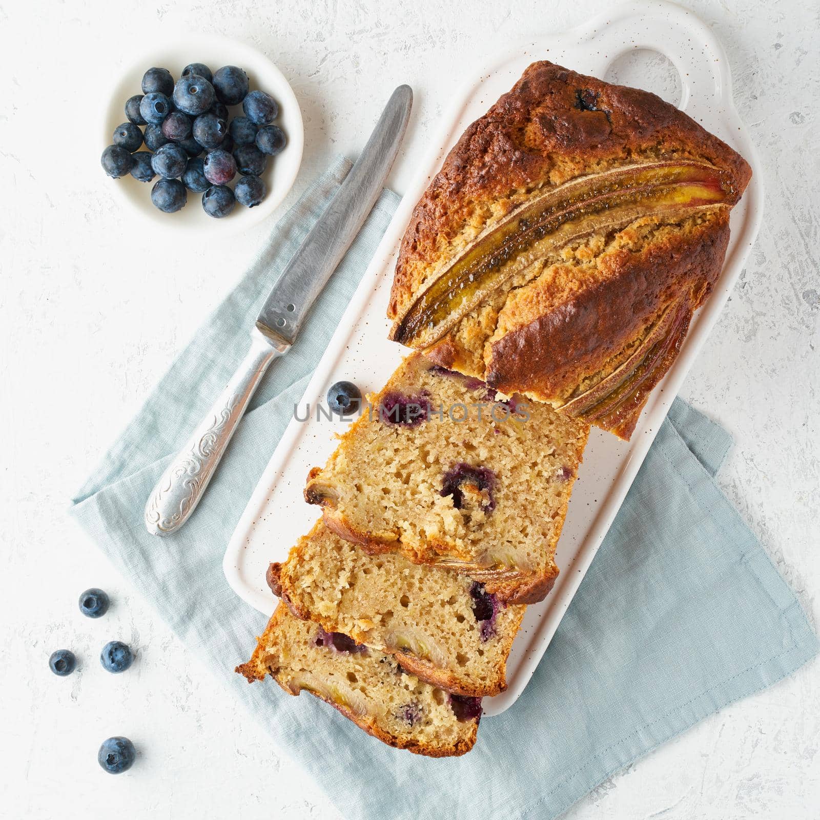 Homemade Banana bread. Baked cake. Top view, white table. by NataBene