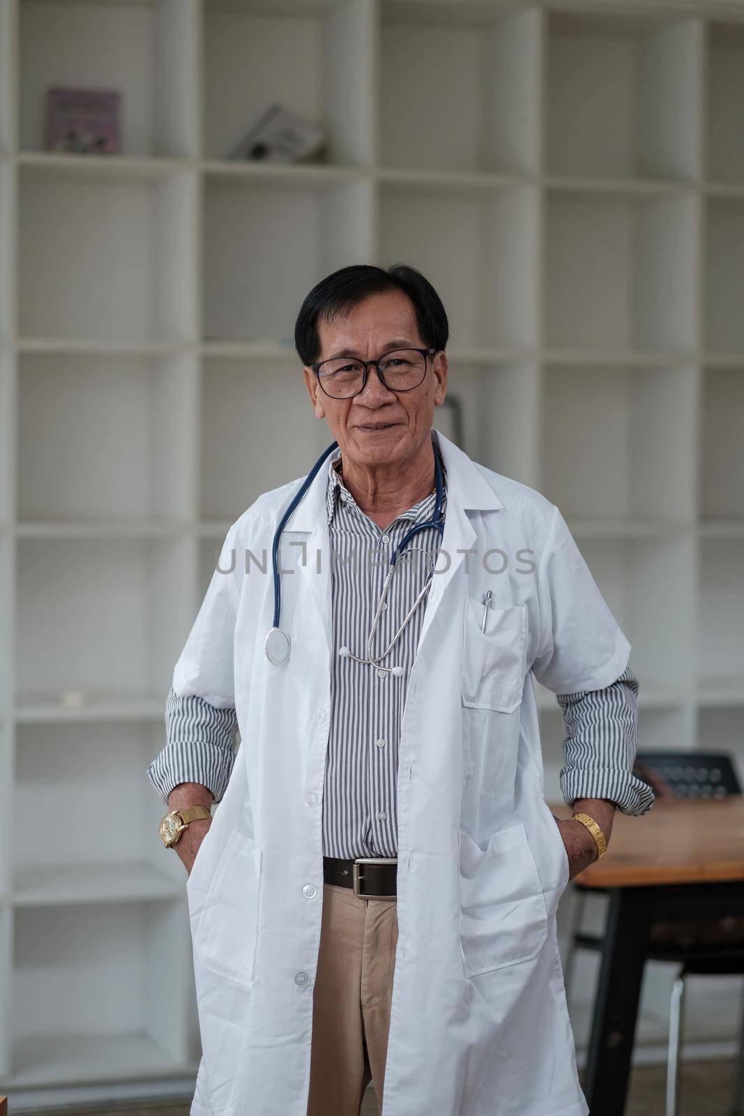 Portrait asian male senior doctor hospital medical clinic medicine health care. by nateemee