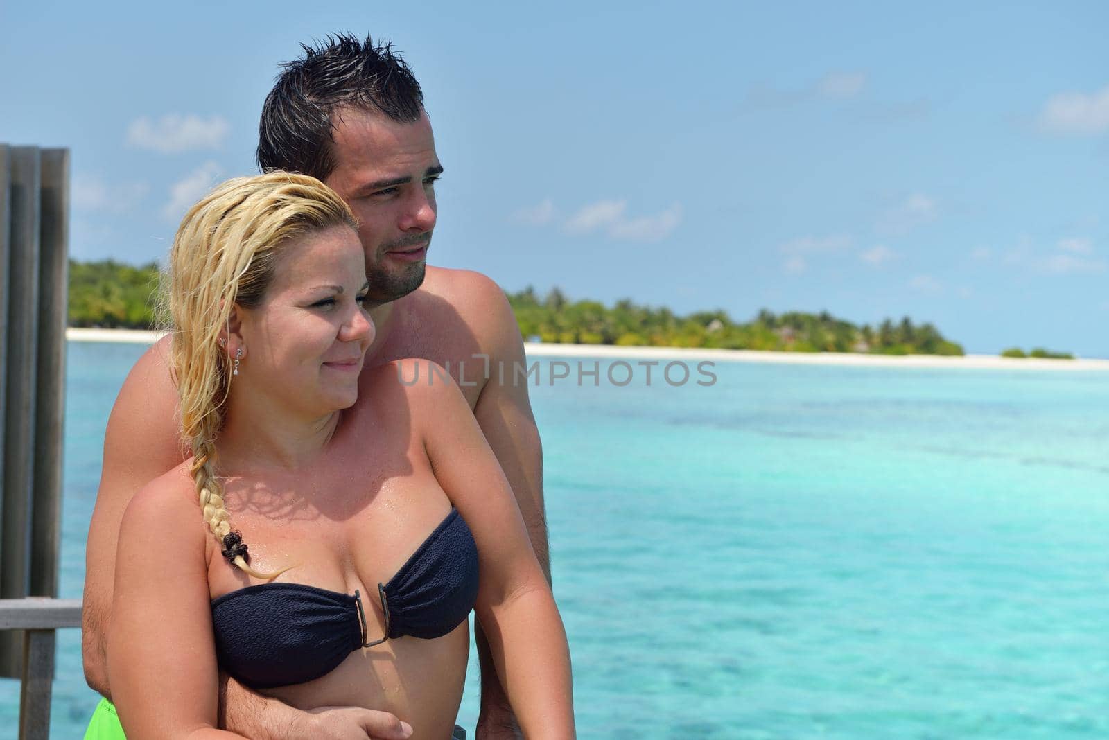 happy young  couple at summer vacation have fun and relax by dotshock