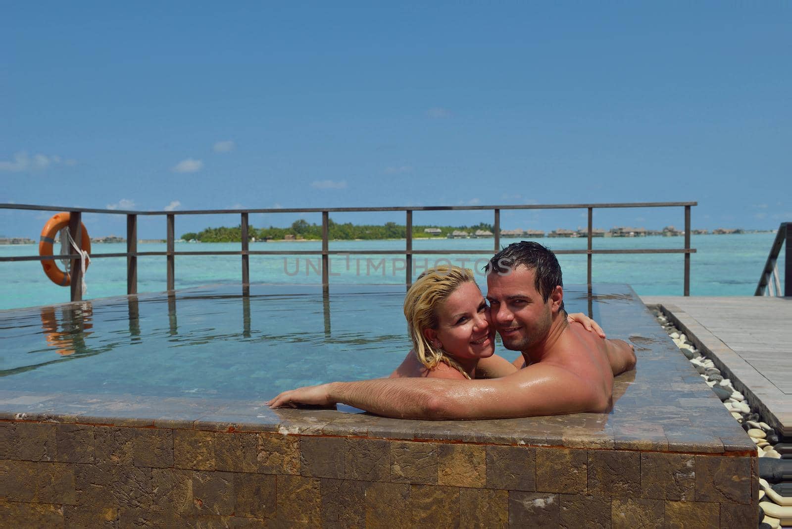 happy young  couple at summer vacation have fun and relax at beautiful sunny  day on beach